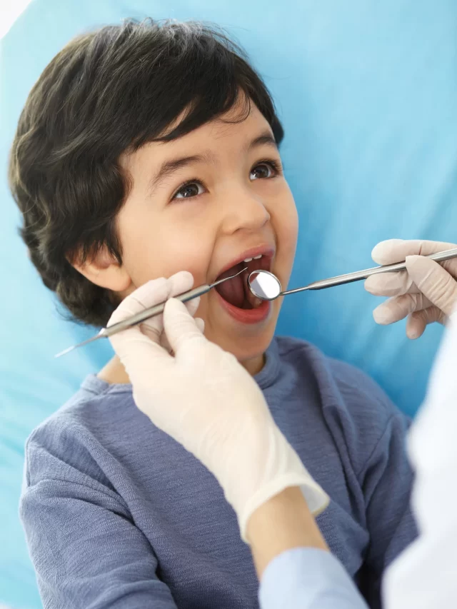 little-arab-boy-sitting-dental-chair-with-open-mouth-during-oral-check-up-while-doctor-visiting-dentist-office-medicine-stomatology-concept